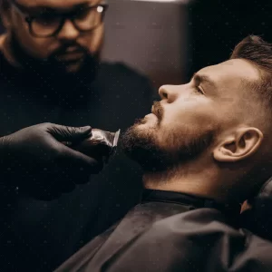dsome-man-cutting-beard-barber-salon